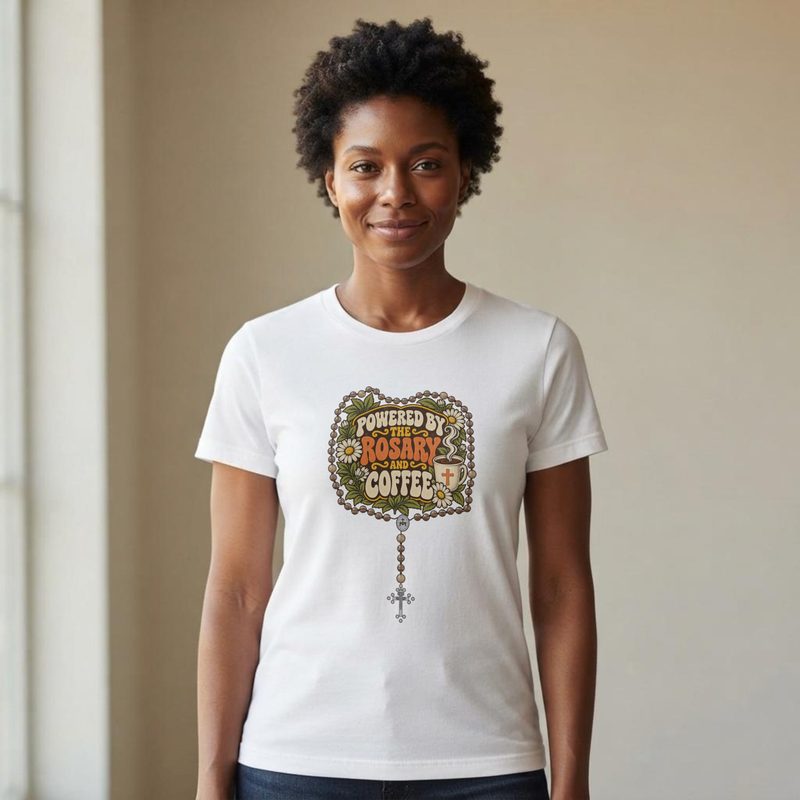 Model wearing the Powered by the Rosary and Coffee Shirt with funny Catholic Mom Tee