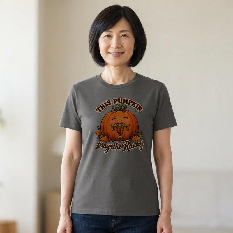 Model wearing the This Pumpkin Prays the Rosary Shirt with cute Catholic Halloween Tee