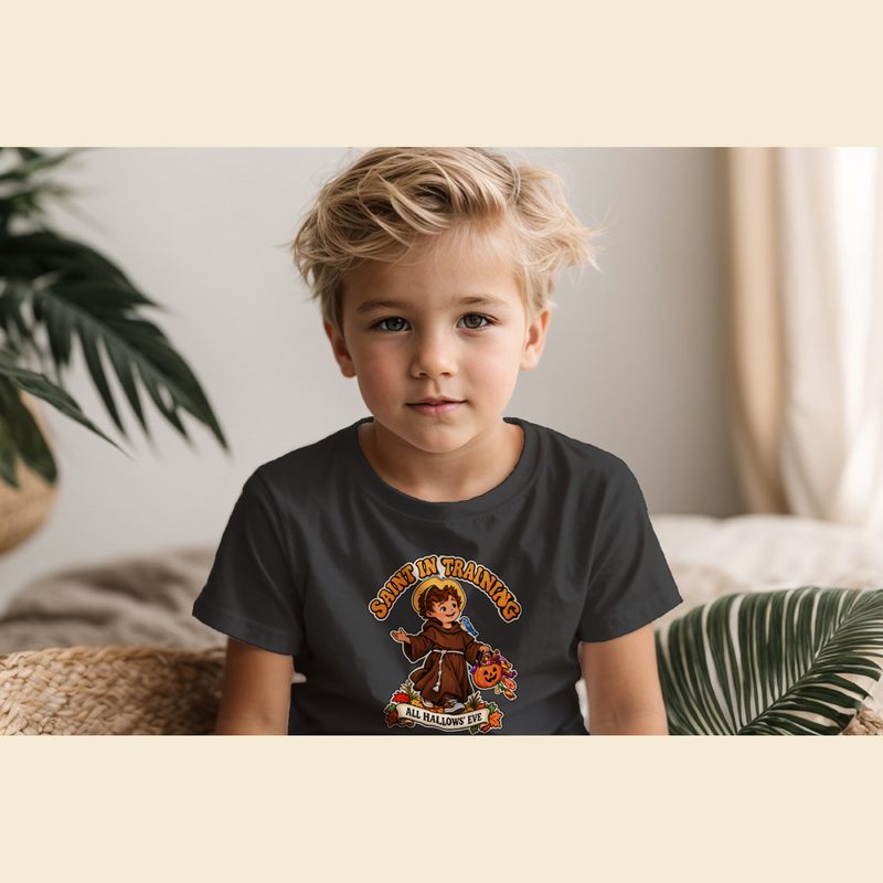 Model wearing the Toddler Saint in Training Tee with little Franciscan Friar Costume